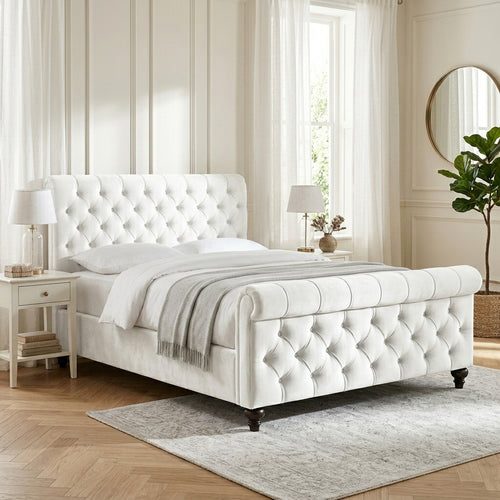 Elegantly styled UK bedroom with silver plush velvet sleigh ottoman bed frame
