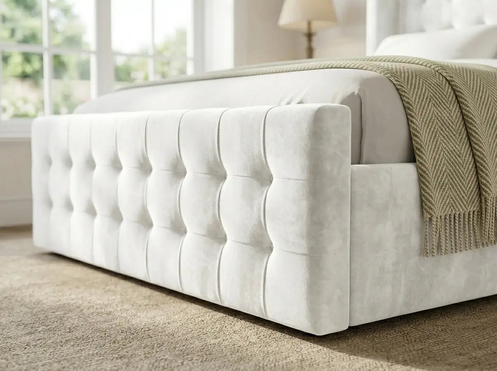 An upholstered Belmont Wingback bed frame showing close up of its deep buttoned footboard