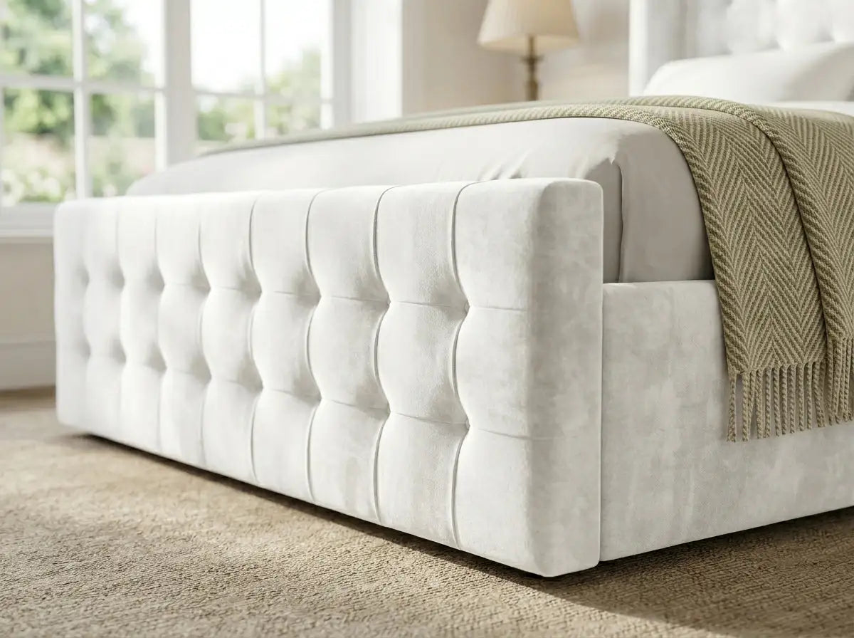 An upholstered Belmont Wingback bed frame showing close up of its deep buttoned footboard